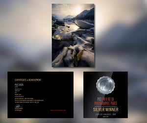Two framed photographs of a snowy landscape with mountains and a certificate of achievement for a silver winner at PX3 Prix de la Photographie Paris.