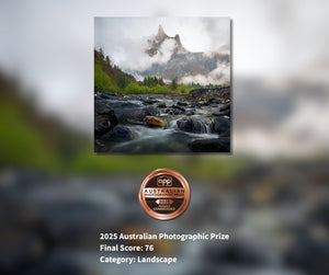 Scenic landscape with a river and mountains, featuring the 2025 Australian Photographic Prize logo.