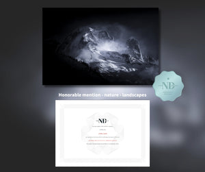 Black and white mountain landscape with an honorable mention certificate for nature landscapes on a dark background.