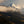 Snow-capped mountain peak with clouds in the foreground